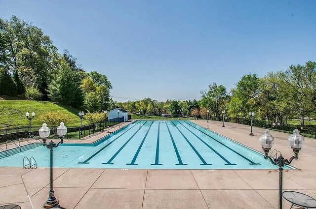 3038 Oxford Glen Dr, Franklin, TN 37067 - community pool featuring fence, a patio, and view of wooded area