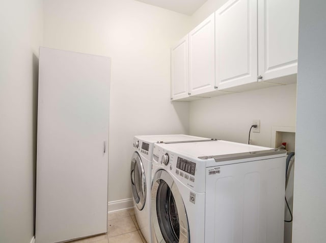 3038 Oxford Glen Dr, Franklin, TN 37067 - laundry room featuring cabinet space, washer and clothes dryer, light tile patterned floors, and baseboards