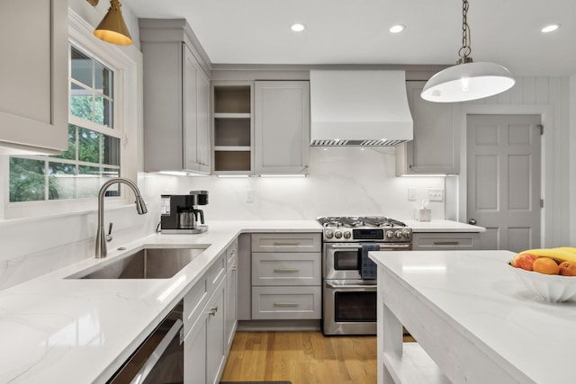 1311 Choctaw Trl, Brentwood, TN 37027 - kitchen with gray cabinets, custom exhaust hood, a sink, range with two ovens, and light stone countertops