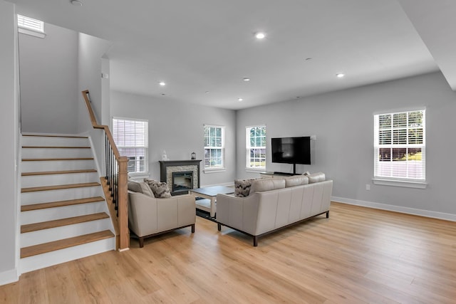 1610 Shenstone Dr, Smyrna, TN 37167 - living room with a fireplace, light wood-style flooring, healthy amount of natural light, recessed lighting, and stairway