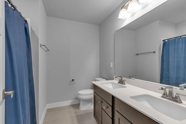 1610 Shenstone Dr, Smyrna, TN 37167 - bathroom with tile patterned floors, double vanity, toilet, baseboards, and a shower with shower curtain