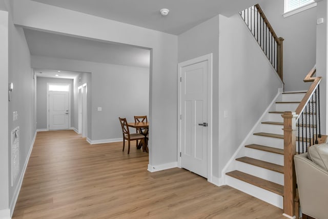 1610 Shenstone Dr, Smyrna, TN 37167 - hallway with light wood finished floors, stairs, and baseboards