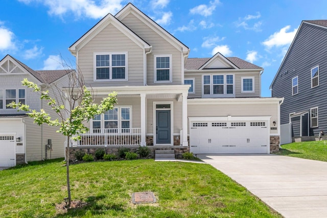 1610 Shenstone Dr, Smyrna, TN 37167 - view of front facade featuring covered porch, stone siding, an attached garage, concrete driveway, and a front lawn