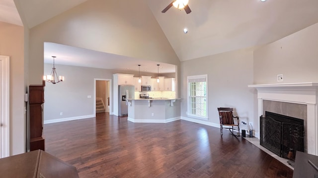 109 Coteswood Ct, Columbia, TN 38401 - living room featuring a fireplace, ceiling fan, dark wood-style floors, stairway, and high vaulted ceiling