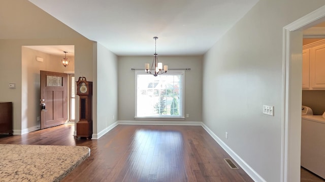109 Coteswood Ct, Columbia, TN 38401 - unfurnished dining area featuring a chandelier, dark wood-style floors, washer / dryer, and baseboards