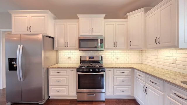 109 Coteswood Ct, Columbia, TN 38401 - kitchen featuring appliances with stainless steel finishes, white cabinets, and dark wood-type flooring