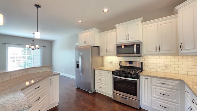 109 Coteswood Ct, Columbia, TN 38401 - kitchen featuring appliances with stainless steel finishes, a chandelier, white cabinetry, recessed lighting, and tasteful backsplash