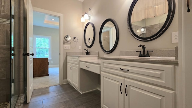 109 Coteswood Ct, Columbia, TN 38401 - full bathroom with double vanity, a tile shower, and baseboards
