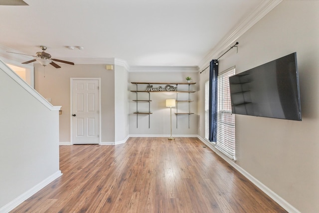 664 Huffine Manor Cir, Franklin, TN 37067 - unfurnished living room featuring wood finished floors, ceiling fan, baseboards, and crown molding
