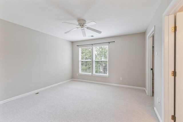 664 Huffine Manor Cir, Franklin, TN 37067 - spare room featuring a ceiling fan, light carpet, and baseboards