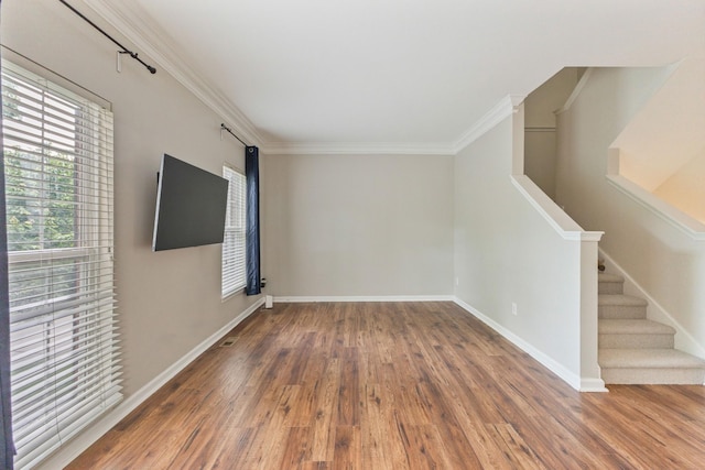 664 Huffine Manor Cir, Franklin, TN 37067 - spare room with ornamental molding, wood finished floors, stairs, and baseboards