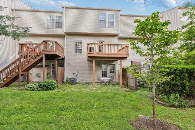 664 Huffine Manor Cir, Franklin, TN 37067 - back of property featuring central AC unit, stairway, and a deck
