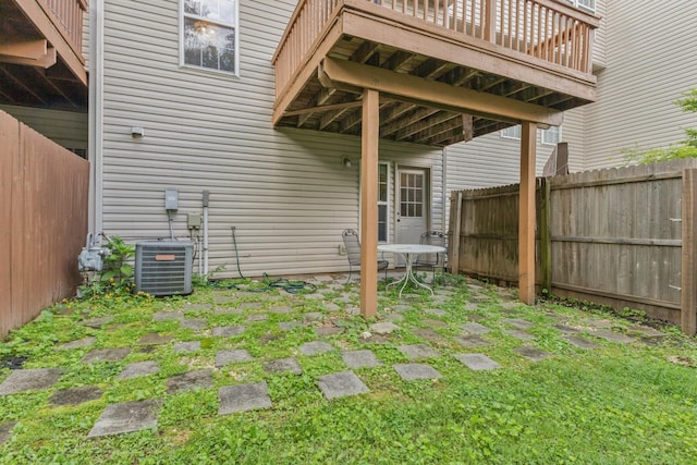 664 Huffine Manor Cir, Franklin, TN 37067 - back of house featuring central air condition unit, a fenced backyard, and a wooden deck