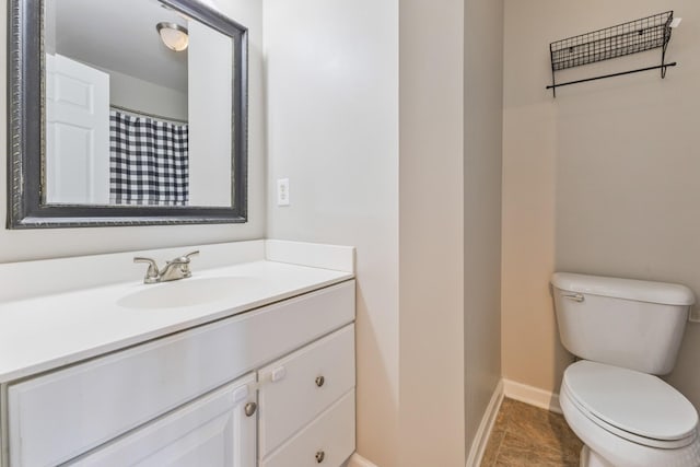 664 Huffine Manor Cir, Franklin, TN 37067 - bathroom with baseboards, vanity, and toilet