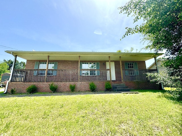 1306 Jared Ct, Clarksville, TN 37042 - view of front facade with a porch, brick siding, and a front yard