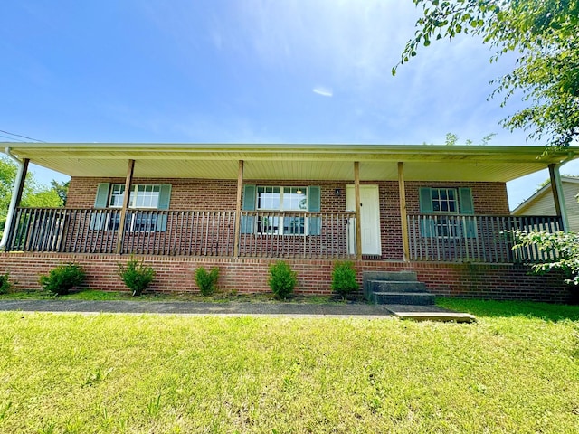 1306 Jared Ct, Clarksville, TN 37042 - view of front of home with covered porch, brick siding, and a front yard