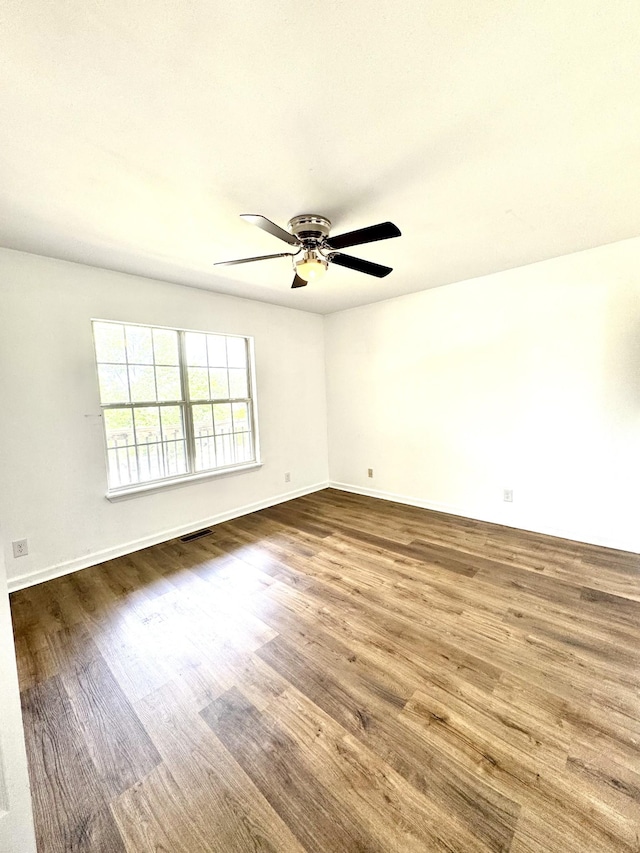 1306 Jared Ct, Clarksville, TN 37042 - spare room featuring wood finished floors, ceiling fan, and baseboards