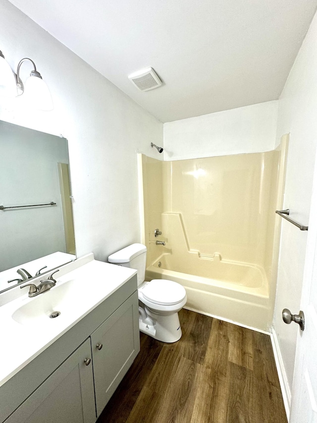1306 Jared Ct, Clarksville, TN 37042 - bathroom featuring wood finished floors, shower / bathtub combination, vanity, and toilet