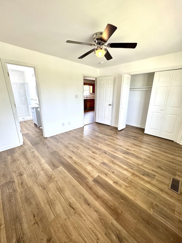 1306 Jared Ct, Clarksville, TN 37042 - unfurnished bedroom featuring wood finished floors, ensuite bathroom, and a closet