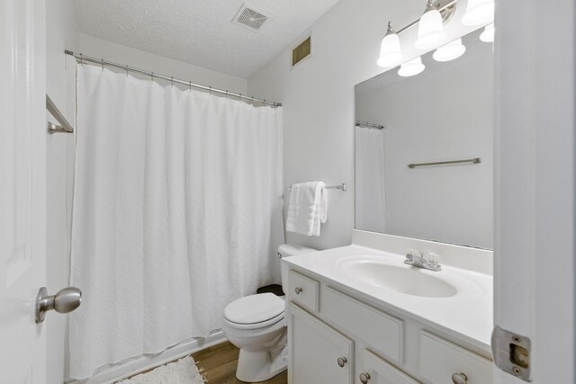 1518 Saint Andrews Dr, Murfreesboro, TN 37128 - full bath featuring toilet, vanity, wood finished floors, a textured ceiling, and a shower with curtain
