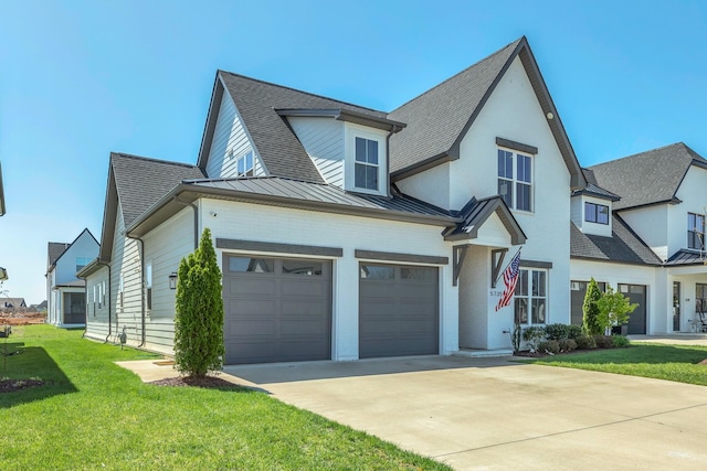 5735 Willoughby Way, Murfreesboro, TN 37129 - view of front of home featuring concrete driveway, a standing seam roof, a front lawn, a shingled roof, and metal roof