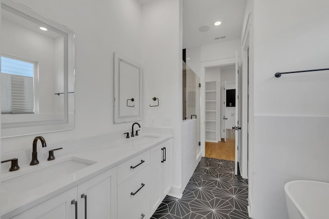 5735 Willoughby Way, Murfreesboro, TN 37129 - full bath featuring a freestanding tub, double vanity, and recessed lighting