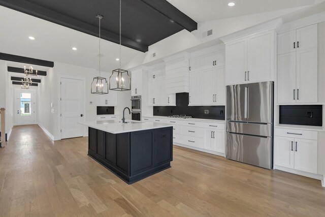 5735 Willoughby Way, Murfreesboro, TN 37129 - kitchen with stainless steel appliances, light countertops, white cabinets, light wood-style flooring, and recessed lighting