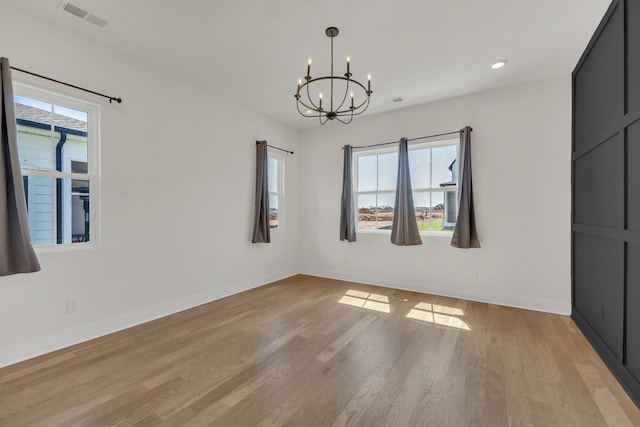 5735 Willoughby Way, Murfreesboro, TN 37129 - spare room featuring a chandelier, plenty of natural light, baseboards, light wood-style flooring, and recessed lighting