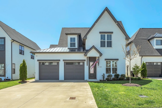 5735 Willoughby Way, Murfreesboro, TN 37129 - view of front of home with a standing seam roof, driveway, a front yard, brick siding, and roof with shingles