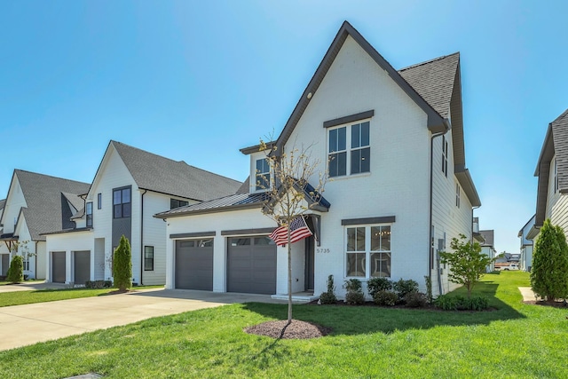 5735 Willoughby Way, Murfreesboro, TN 37129 - view of front of property with driveway, a front yard, brick siding, and an attached garage
