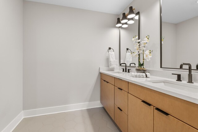 725 N Highland Ave, Murfreesboro, TN 37130 - bathroom featuring double vanity, baseboards, and tile patterned floors