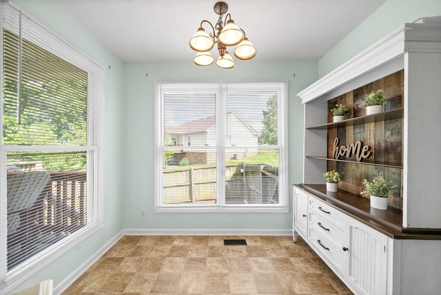 3659 Fieldstone Dr, Clarksville, TN 37040 - unfurnished dining area featuring baseboards and a chandelier