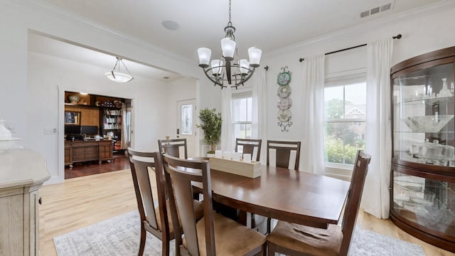 420 Fannis Cir, Gallatin, TN 37066 - dining room with light wood-type flooring, crown molding, and a chandelier
