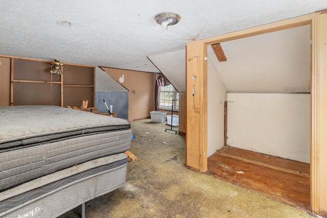 104 Lowe St, Ashland City, TN 37015 - unfurnished bedroom featuring a textured ceiling and vaulted ceiling
