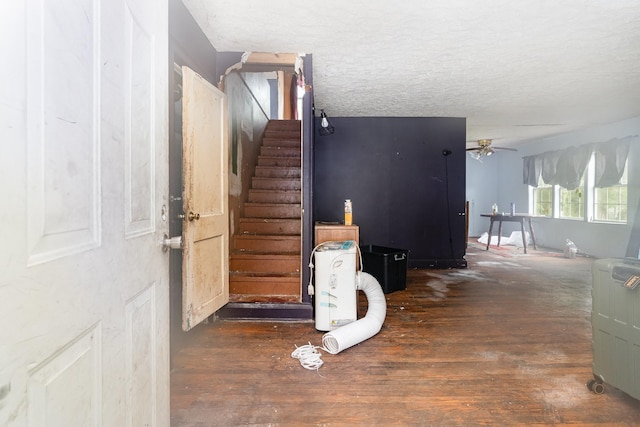 104 Lowe St, Ashland City, TN 37015 - stairs with a ceiling fan, wood finished floors, and a textured ceiling