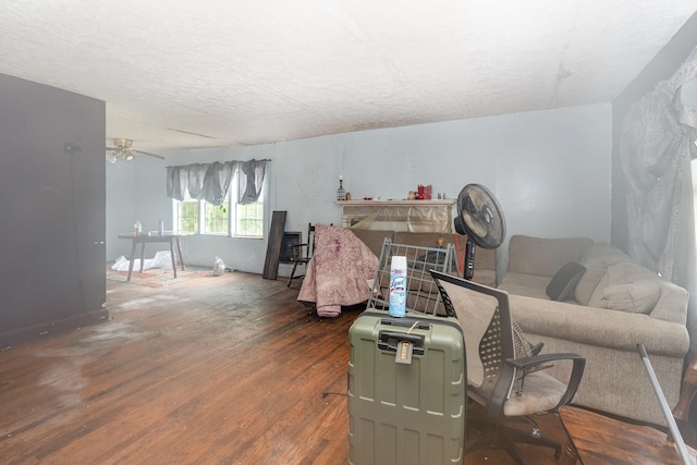 104 Lowe St, Ashland City, TN 37015 - living room featuring wood finished floors, a textured ceiling, and ceiling fan