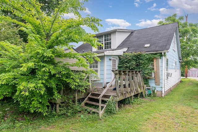104 Lowe St, Ashland City, TN 37015 - back of house with a deck, roof with shingles, and a lawn