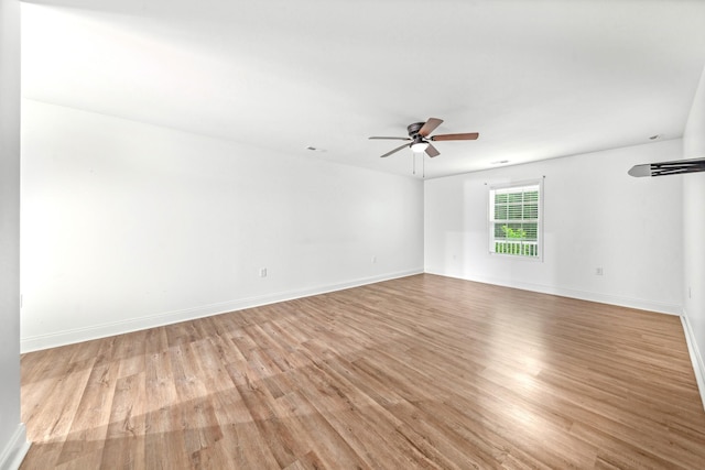 101 Henry Thompson Rd, Taft, TN 38488 - spare room with ceiling fan, light wood-style floors, and baseboards