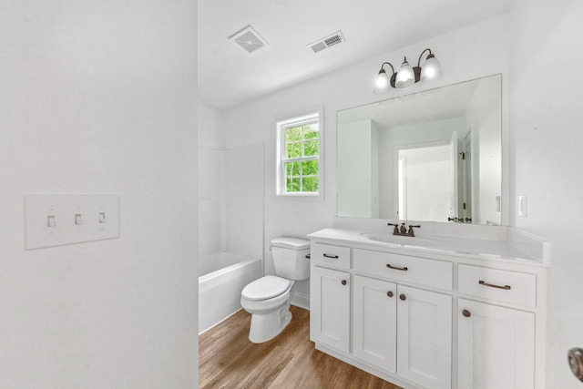 101 Henry Thompson Rd, Taft, TN 38488 - bathroom featuring toilet, wood finished floors, vanity, and  shower combination