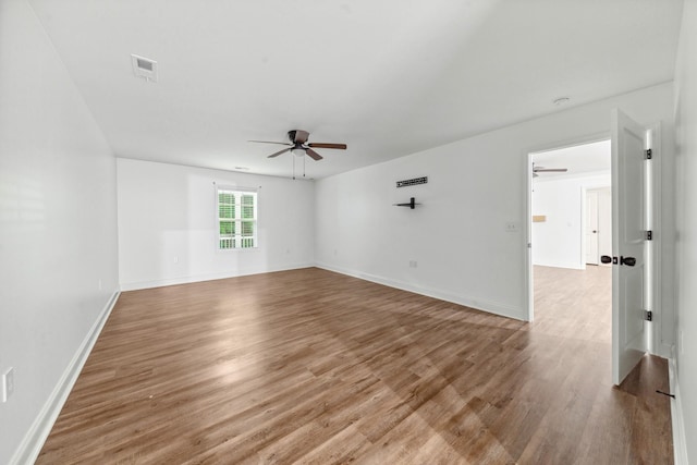 101 Henry Thompson Rd, Taft, TN 38488 - unfurnished room with a ceiling fan, wood finished floors, and baseboards