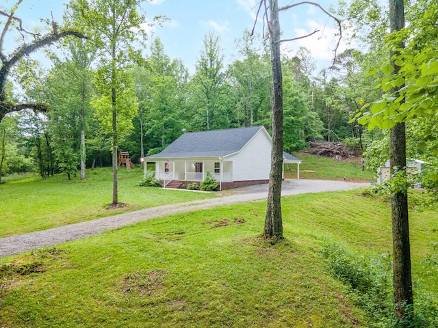 101 Henry Thompson Rd, Taft, TN 38488 - view of front of property with dirt driveway, a porch, and a front yard
