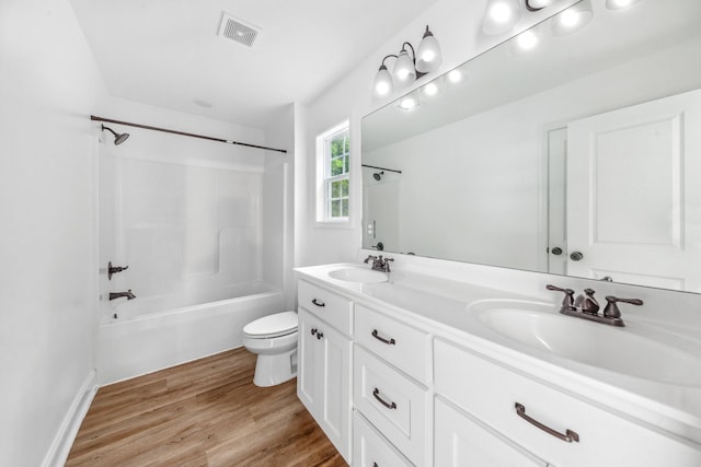 101 Henry Thompson Rd, Taft, TN 38488 - full bath featuring wood finished floors, toilet, shower / tub combination, and double vanity