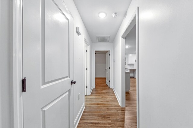 101 Henry Thompson Rd, Taft, TN 38488 - corridor with wood finished floors and baseboards