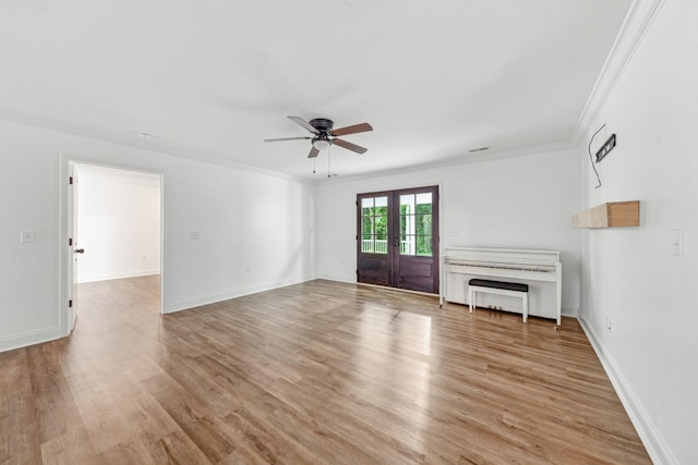 101 Henry Thompson Rd, Taft, TN 38488 - unfurnished living room featuring french doors, a ceiling fan, crown molding, light wood finished floors, and baseboards