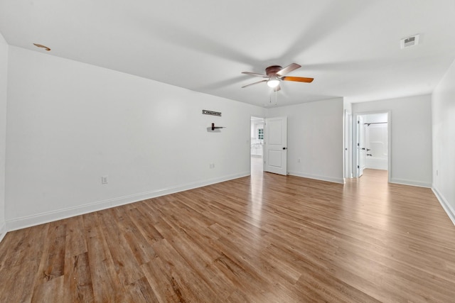 101 Henry Thompson Rd, Taft, TN 38488 - unfurnished living room featuring light wood-style floors, a ceiling fan, and baseboards