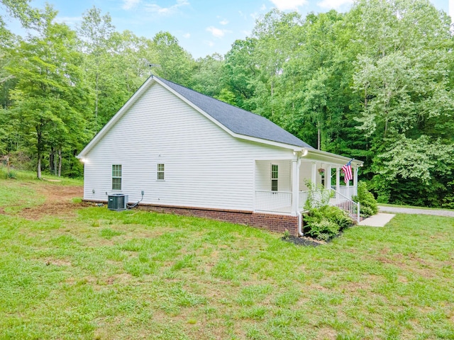 101 Henry Thompson Rd, Taft, TN 38488 - view of side of property with covered porch, a yard, and central air condition unit