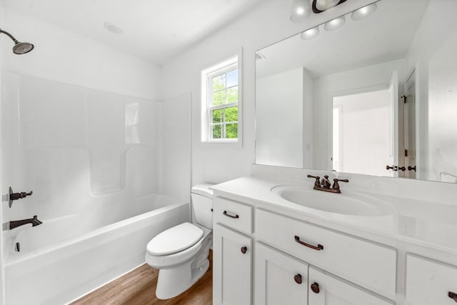 101 Henry Thompson Rd, Taft, TN 38488 - full bathroom featuring wood finished floors, toilet, vanity, and bathtub / shower combination