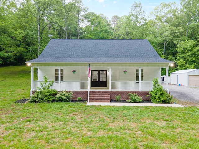 101 Henry Thompson Rd, Taft, TN 38488 - view of front of property with a porch, a front yard, and roof with shingles