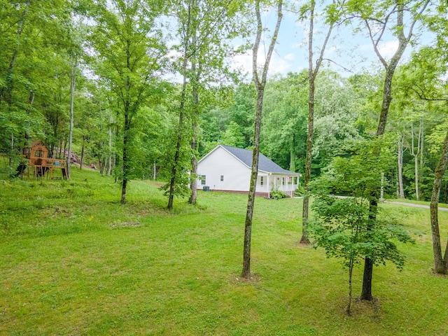 101 Henry Thompson Rd, Taft, TN 38488 - view of grassy yard featuring a view of trees