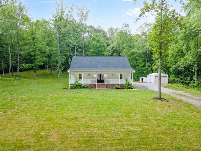 101 Henry Thompson Rd, Taft, TN 38488 - view of front facade with an outbuilding, a front lawn, french doors, and driveway